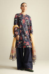 Zara Shahjahan Meadow-1B from COCO Prints '25 Drop – Four is a stunning three-piece printed lawn suit, completed with a dyed trouser and chiffon dupatta. Designed for elegance and everyday sophistication.